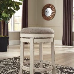 Ashley Dining Room Realyn - Chipped White - Upholstered Swivel Stool (1/CN)